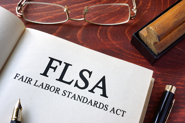 Page with FLSA fair labor standards act on a table